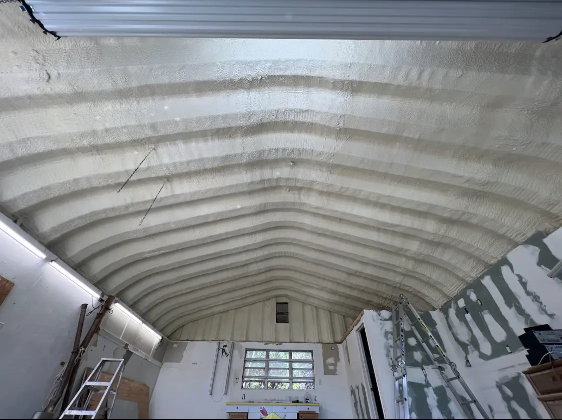 Spray polyurethane foam applied to the underside of a metal roof deck in Fountain